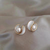 Luxurious gold earrings with white opal and pearl