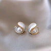 Luxurious gold earrings with white opal and pearl
